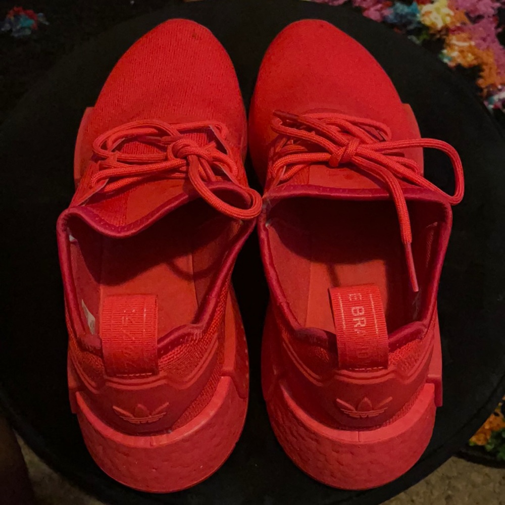 Adidas red sneakers. Worn once. Dirt mark at toe.